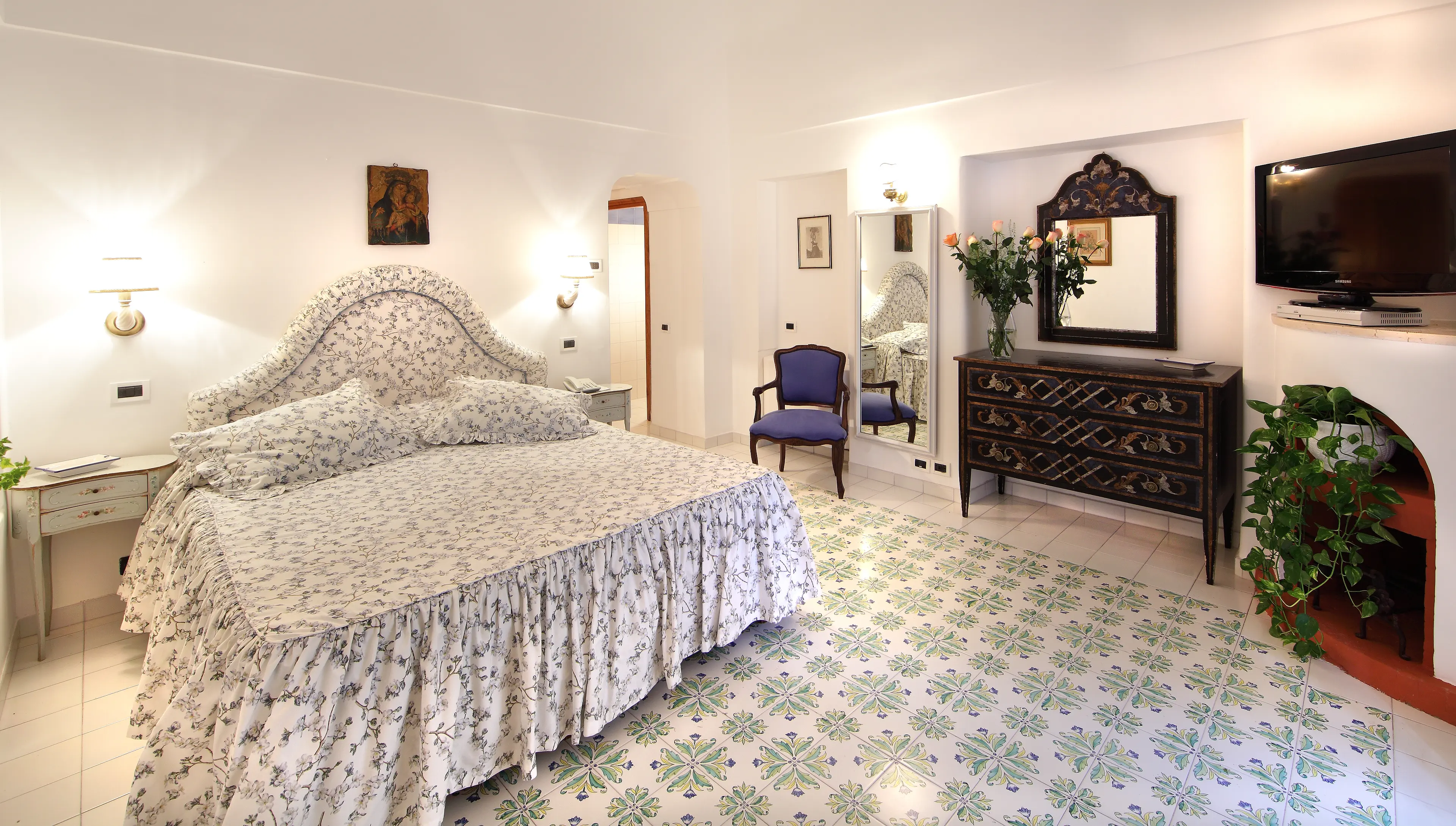 Lateral-facing room with floral bedspread