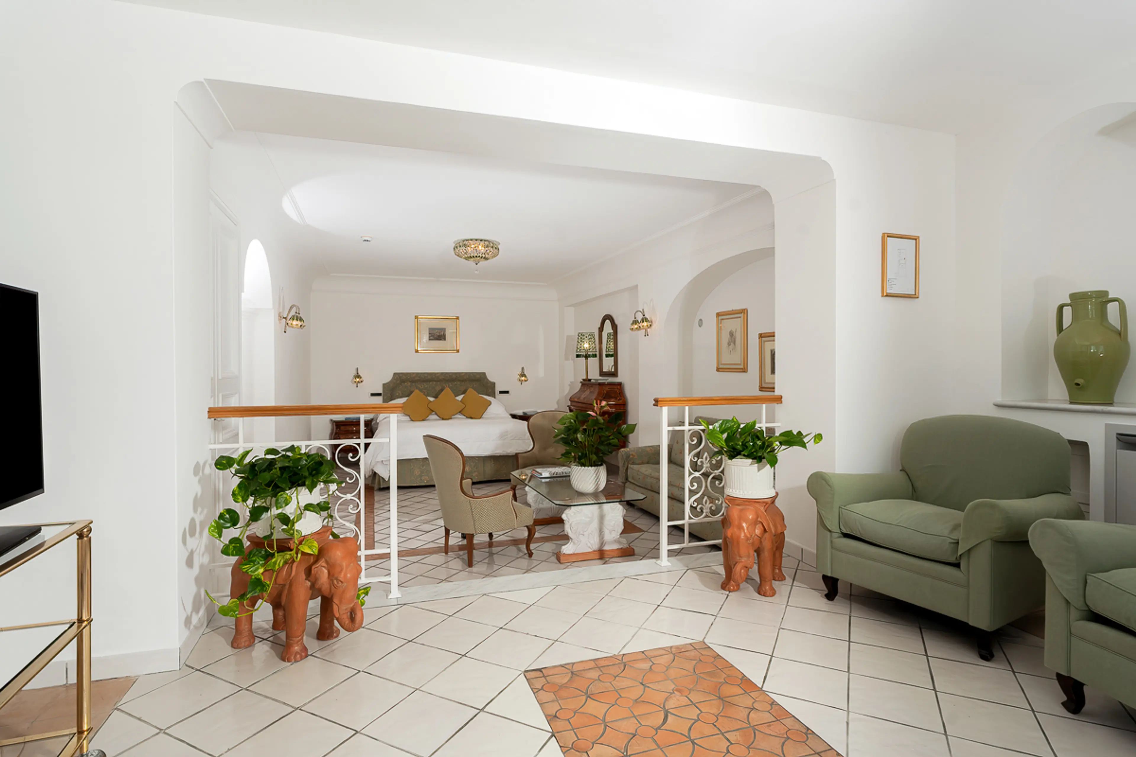 Deluxe Junior Suite Sea View sitting room with damask sofa