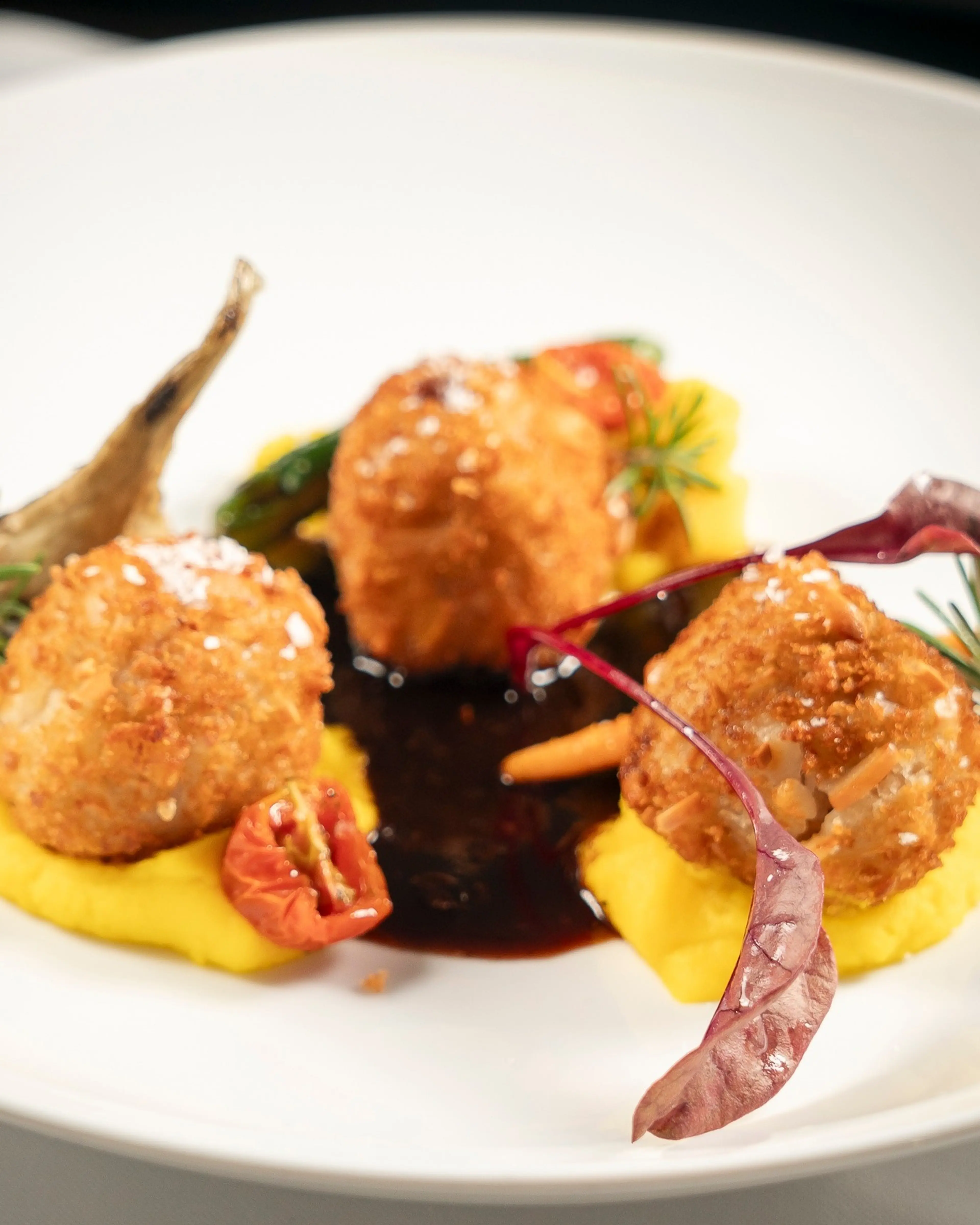 Breaded veal medallions with pumpkin purée