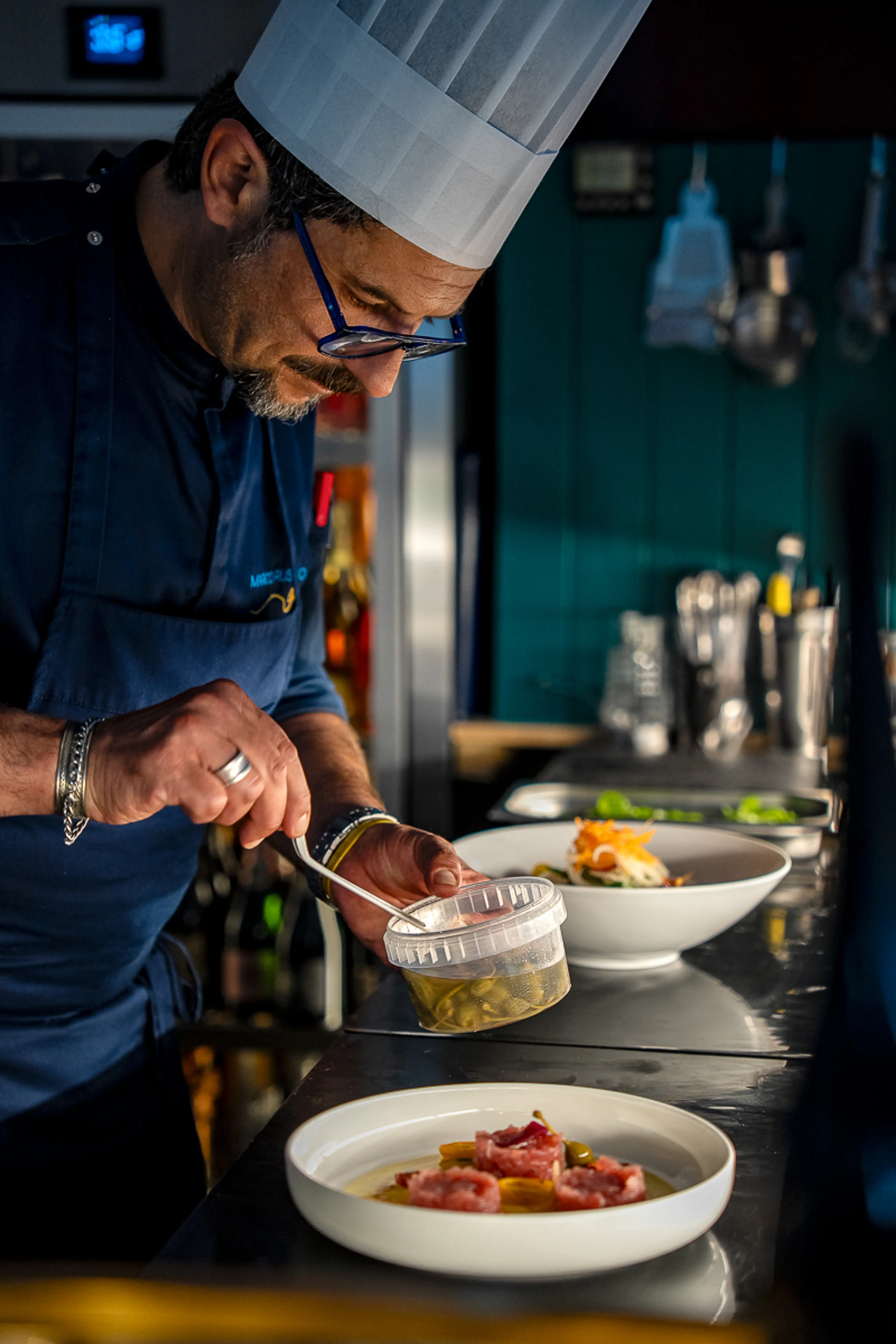 Chef Marco Russo plating tuna tartare