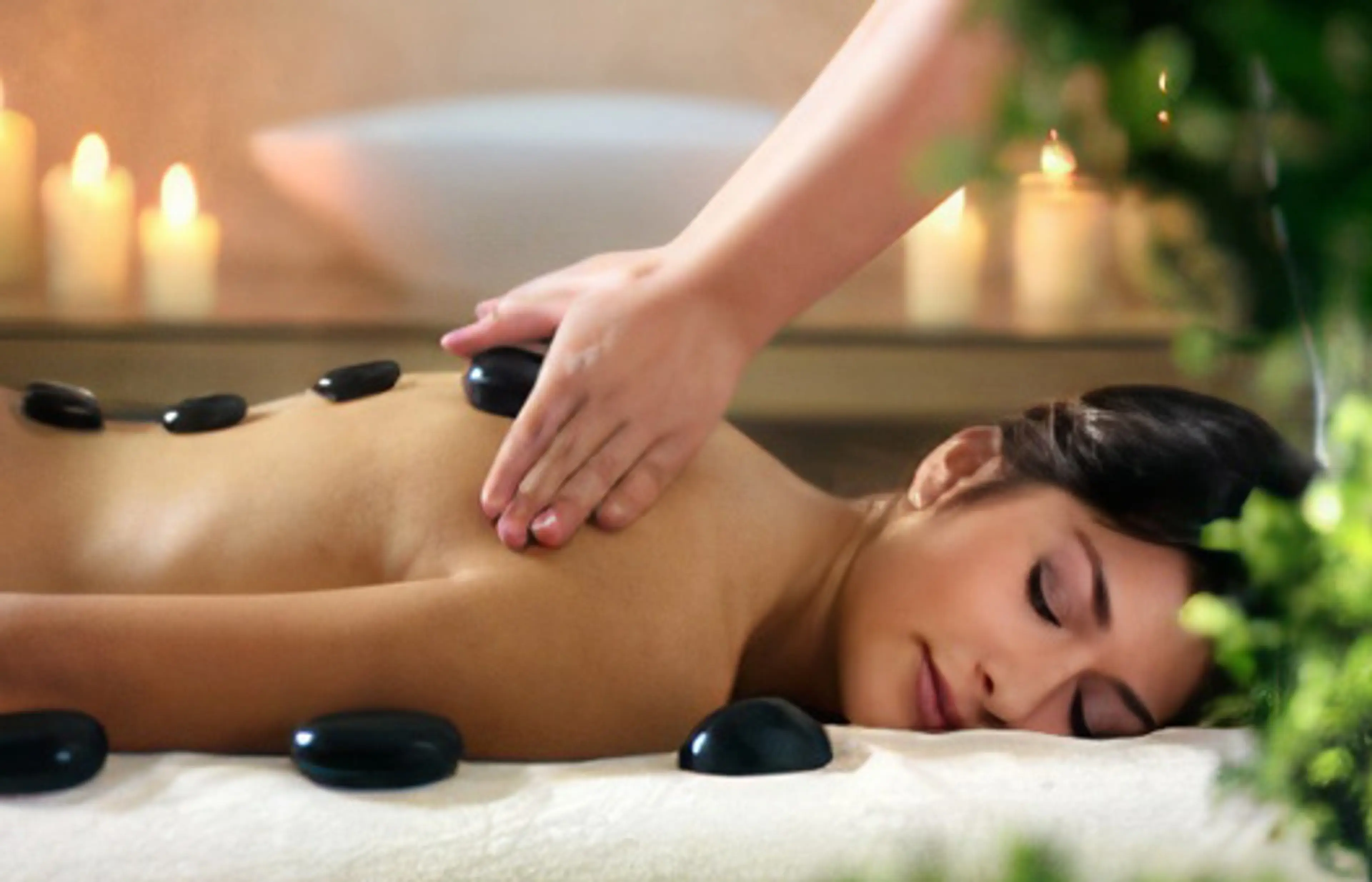 Hot stone massage by candlelight